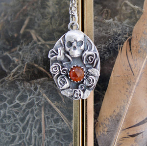 Orange Kyanite, Skull and roses pendant.
