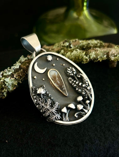 sterling and 9kt gold pendant with repurposed diamond.