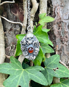 Orange Kyanite, Skull and roses pendant.