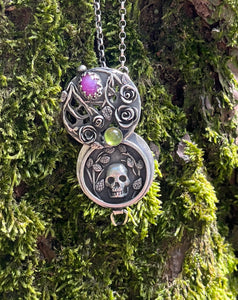 Duality locket, today we bloom, tomorrow we die.  Sterling silver with ruby and vesuvianite.