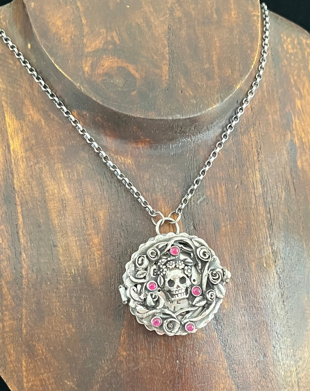 Duality pendant....  Tiny Rubies and a keepsake coin inside.  Sterling silver handmade.