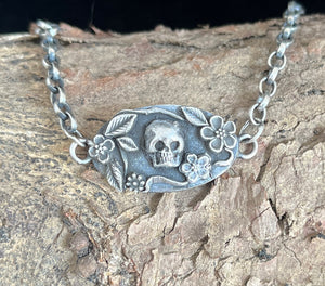 Skull and flower bracelet.  Sterling silver.