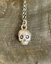 Load image into Gallery viewer, Sterling silver skull with 2 blue sapphire eyes.