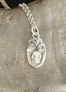 Tiny Skull no. 3. handmade sterling silver pendant.