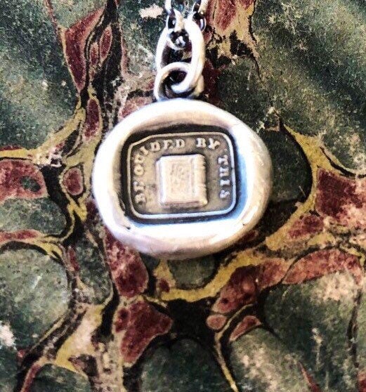 be guided by this, holy bible, good book.  Let the Bible guide you.  Religious jewelry, sterling silver antique wax letter seal.