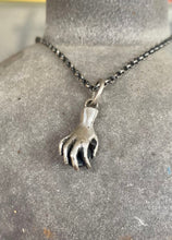 Load image into Gallery viewer, Hand pendant holding a faceted amethyst. Sterling silver handmade stone set pendant.