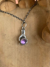 Load image into Gallery viewer, Hand pendant holding a faceted amethyst. Sterling silver handmade stone set pendant.