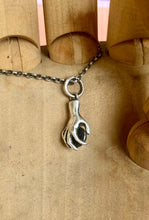 Load image into Gallery viewer, Hand pendant holding a faceted amethyst. Sterling silver handmade stone set pendant.