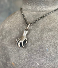 Load image into Gallery viewer, Hand pendant holding a faceted amethyst. Sterling silver handmade stone set pendant.