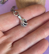 Load image into Gallery viewer, Hand pendant holding a faceted amethyst. Sterling silver handmade stone set pendant.