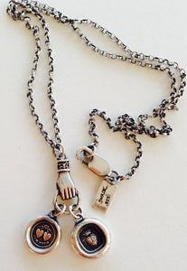 Antique wax letter seal necklace, with heart charms, on a long sterling rolo chain, with a hand holder.