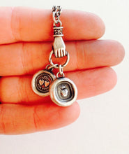 Load image into Gallery viewer, Antique wax letter seal necklace, with heart charms, on a long sterling rolo chain, with a hand holder.