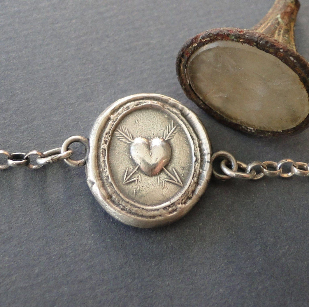 Heart bracelet,  antique wax latter seal 'lovestruck'., sterling silver chain bracelet.