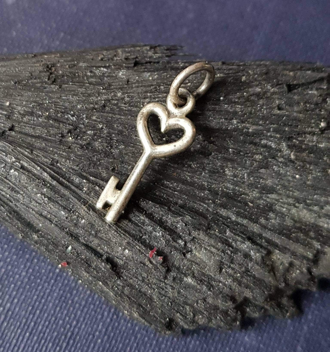 tiny key pendant.  sterling  'add on'  charm for your antique wax seal jewelry.