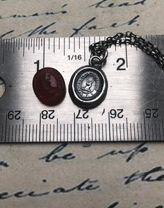 Vincit veritas, truth prevails. Antique wax letter seal pendant. Sterling silver victorian seal impression.