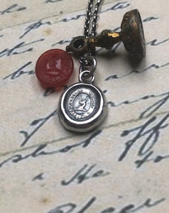 Vincit veritas, truth prevails. Antique wax letter seal pendant. Sterling silver victorian seal impression.
