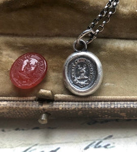 Vincit veritas, truth prevails. Antique wax letter seal pendant. Sterling silver victorian seal impression.