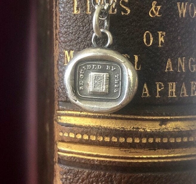 be guided by this, holy bible, good book.  Let the Bible guide you.  Religious jewelry, sterling silver antique wax letter seal.