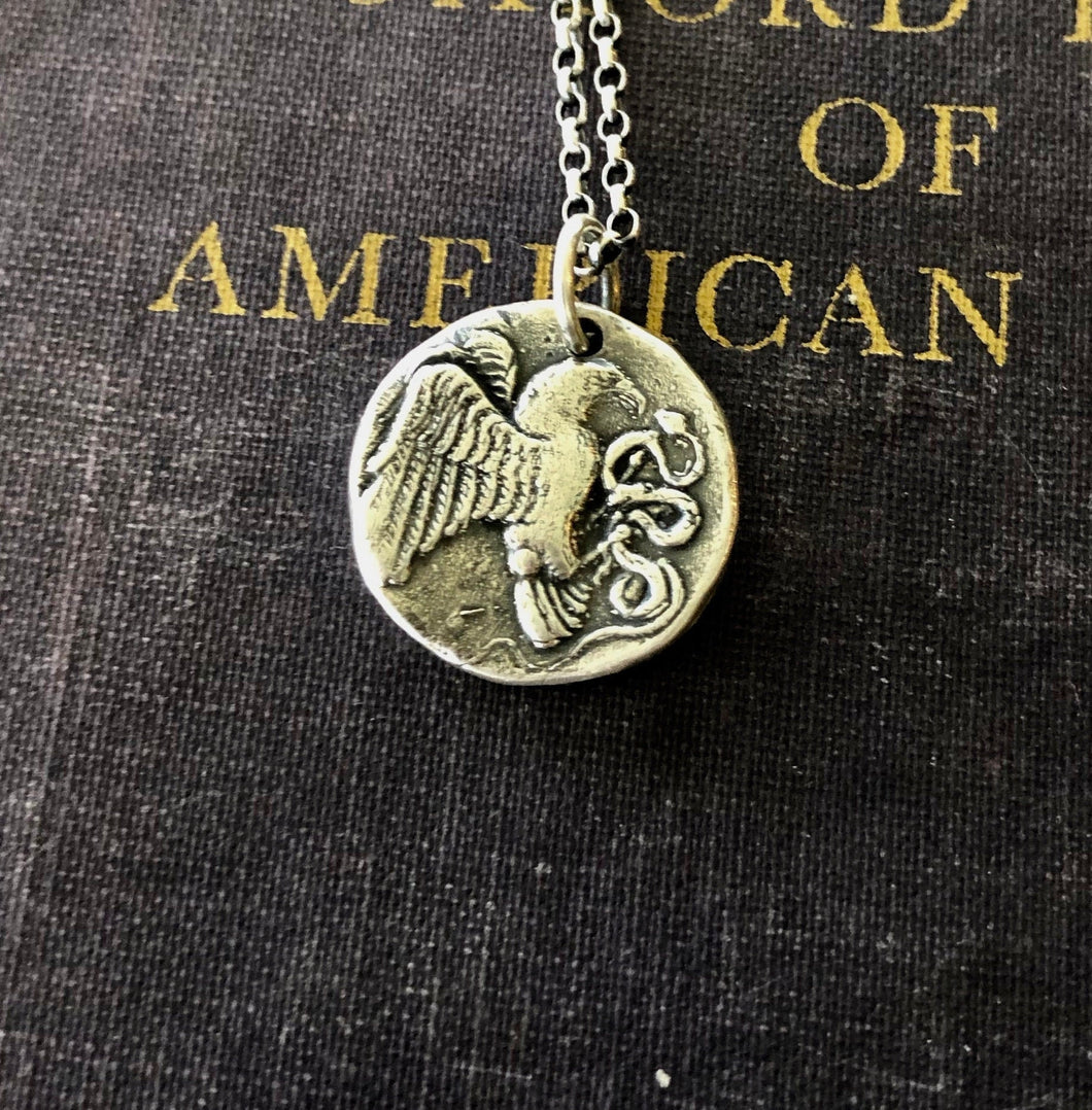 Eagle and Snake. Sterling silver  Antique Greek coin replica. Represents a huge struggle.
