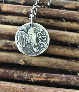 Eagle and Snake. Sterling silver  Antique Greek coin replica. Represents a huge struggle.