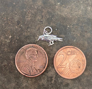 Itsy bitsy tiny raven.  Tiny crow add on to enhance your amulets. Sterling silver bird charm.