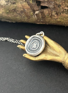 Cycle of life, rebirth, immortality, butterfly and ouroboros. Antique wax seal impression in sterling silver.