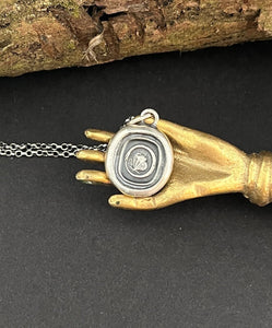 Cycle of life, rebirth, immortality, butterfly and ouroboros. Antique wax seal impression in sterling silver.
