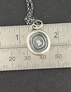 Cycle of life, rebirth, immortality, butterfly and ouroboros. Antique wax seal impression in sterling silver.