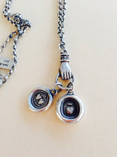 Load image into Gallery viewer, Antique wax letter seal necklace, with heart charms, on a long sterling rolo chain, with a hand holder.