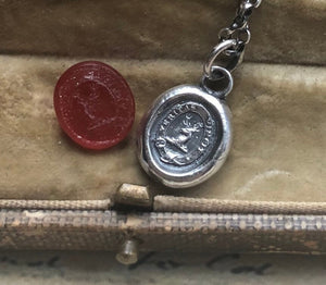Vincit veritas, truth prevails. Antique wax letter seal pendant. Sterling silver victorian seal impression.