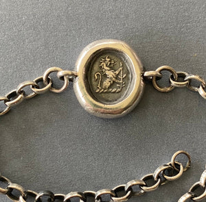 Sterling silver &#39;Valiant&#39; lion bracelet. Antique wax letter seal impression