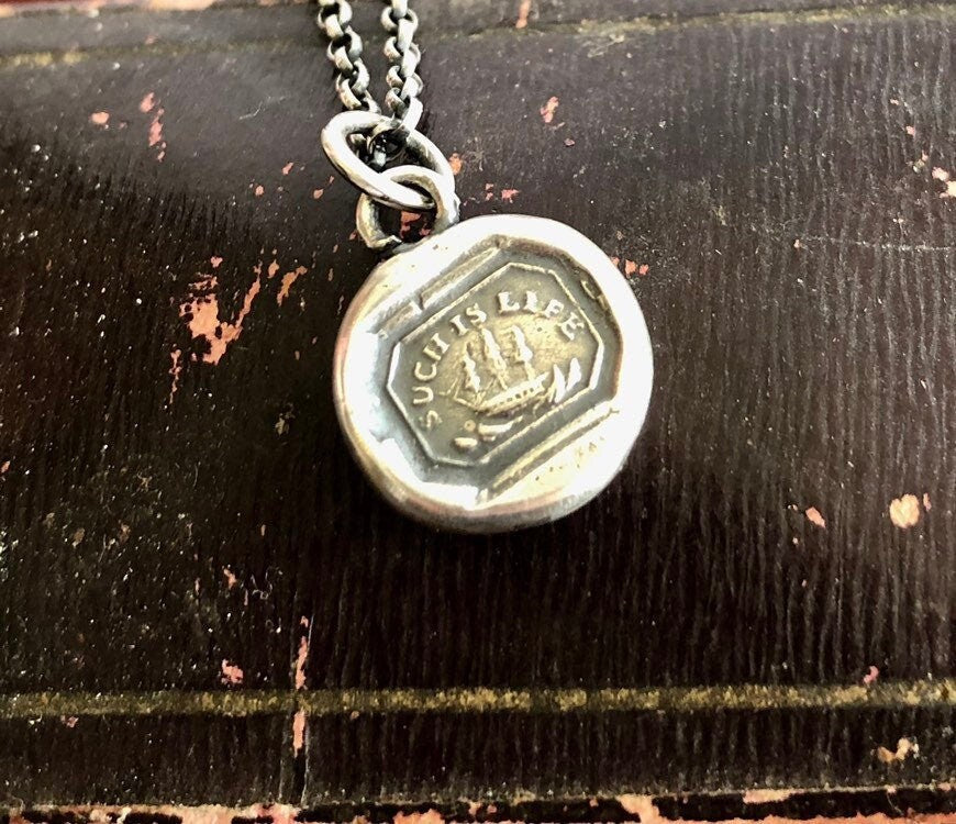 Such is life. Tiny antique wax letter seal pendant.