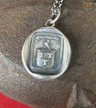 Load image into Gallery viewer, Courage, have to courage to succeed. Reap your rewards.  success. Lion and weath sheafs heraldry pendant. Antique wax seal impression.