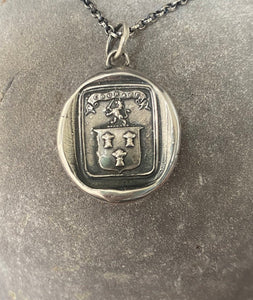 Courage, have to courage to succeed. Reap your rewards.  success. Lion and weath sheafs heraldry pendant. Antique wax seal impression.