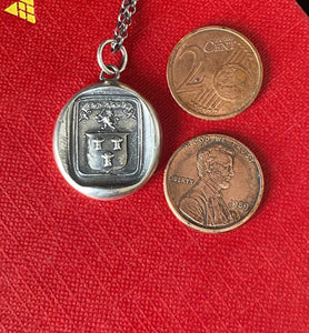 Courage, have to courage to succeed. Reap your rewards.  success. Lion and weath sheafs heraldry pendant. Antique wax seal impression.