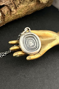 Cycle of life, rebirth, immortality, butterfly and ouroboros. Antique wax seal impression in sterling silver.
